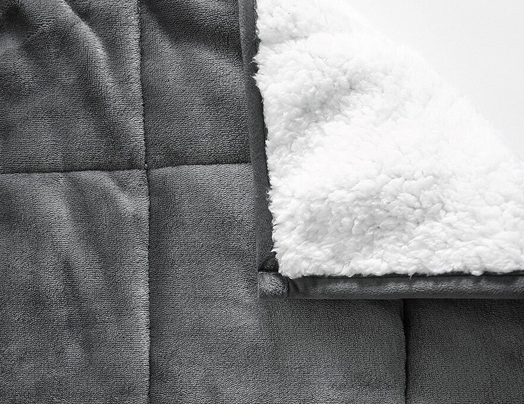 corner on soft grey reversible sherpa weighted blanket