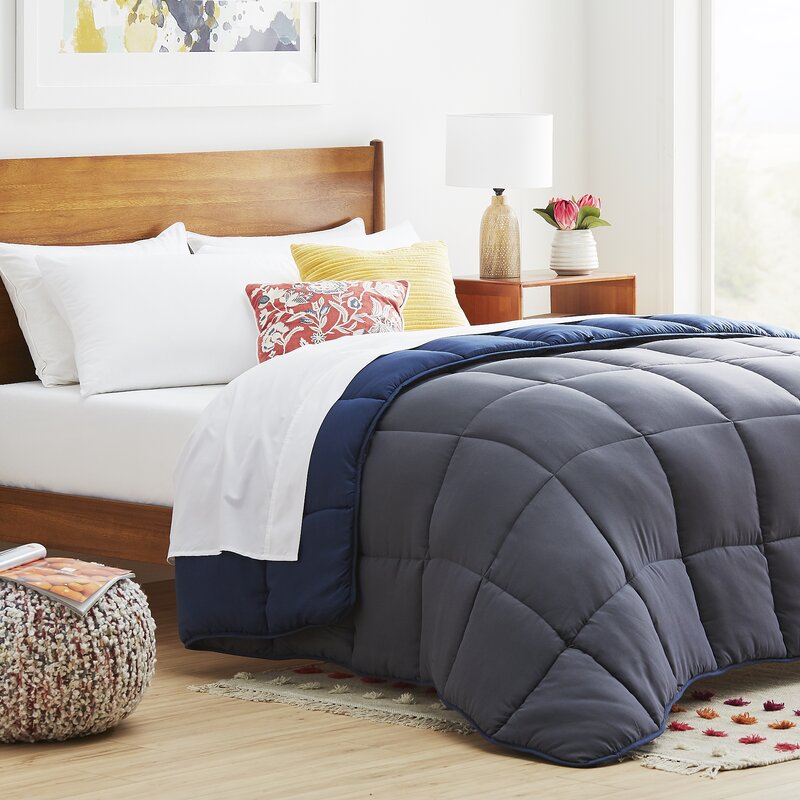 cozy bedroom with reversible blue comforter