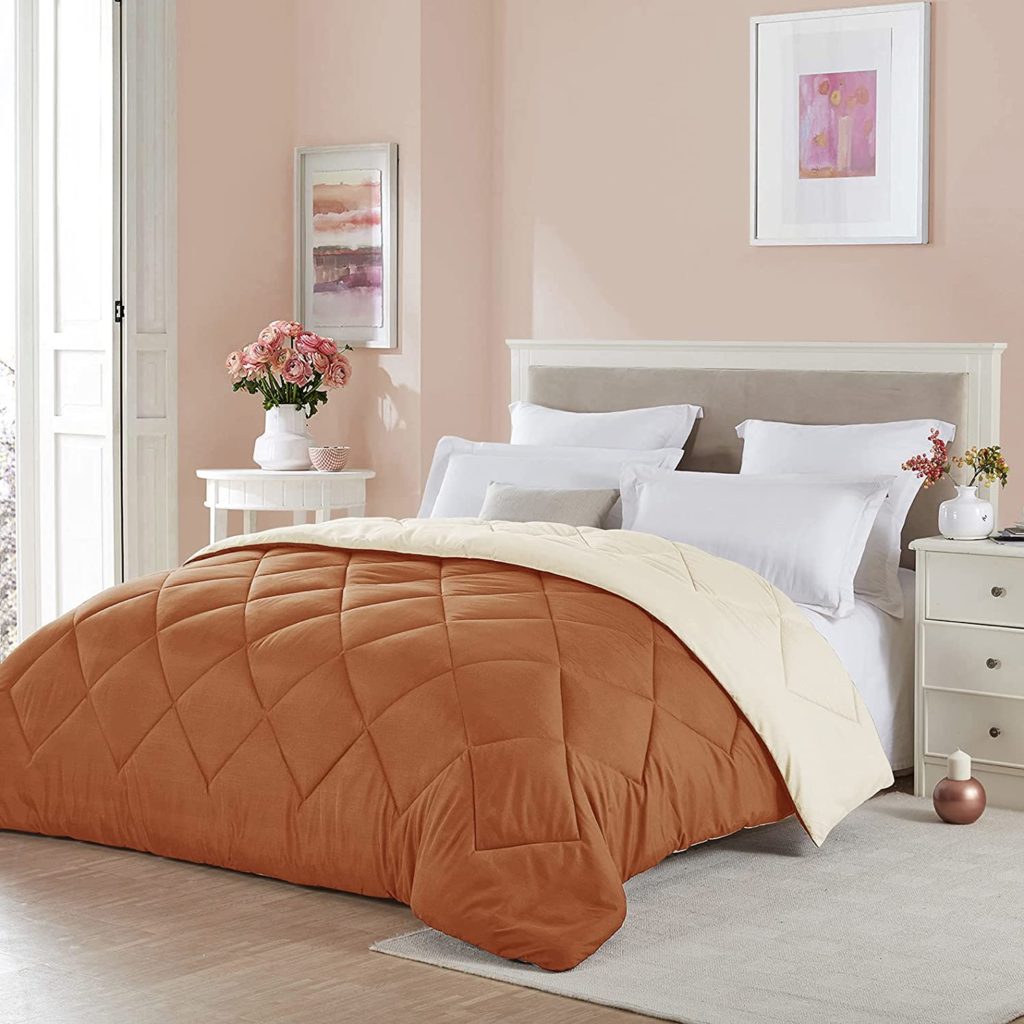 cozy bedroom with reversible orange comforter 1