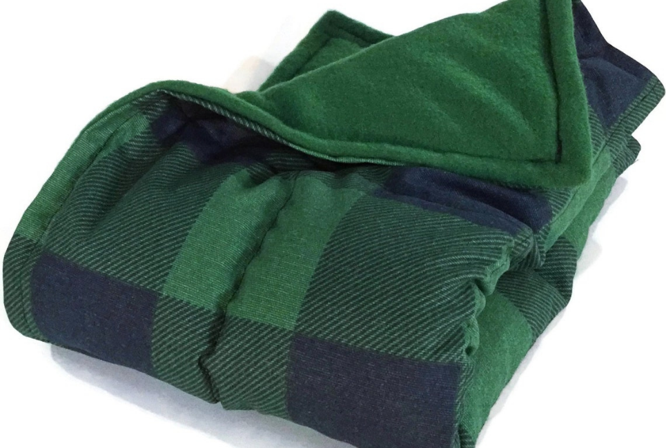 green and black checkered blanket folded neatly