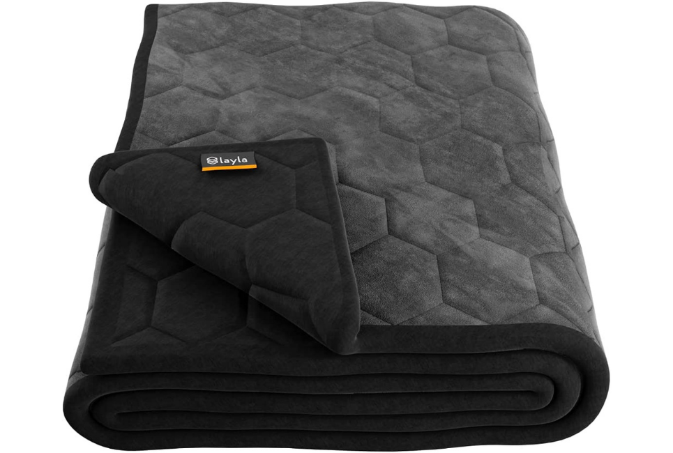 grey and black reversible blanket folded neatly