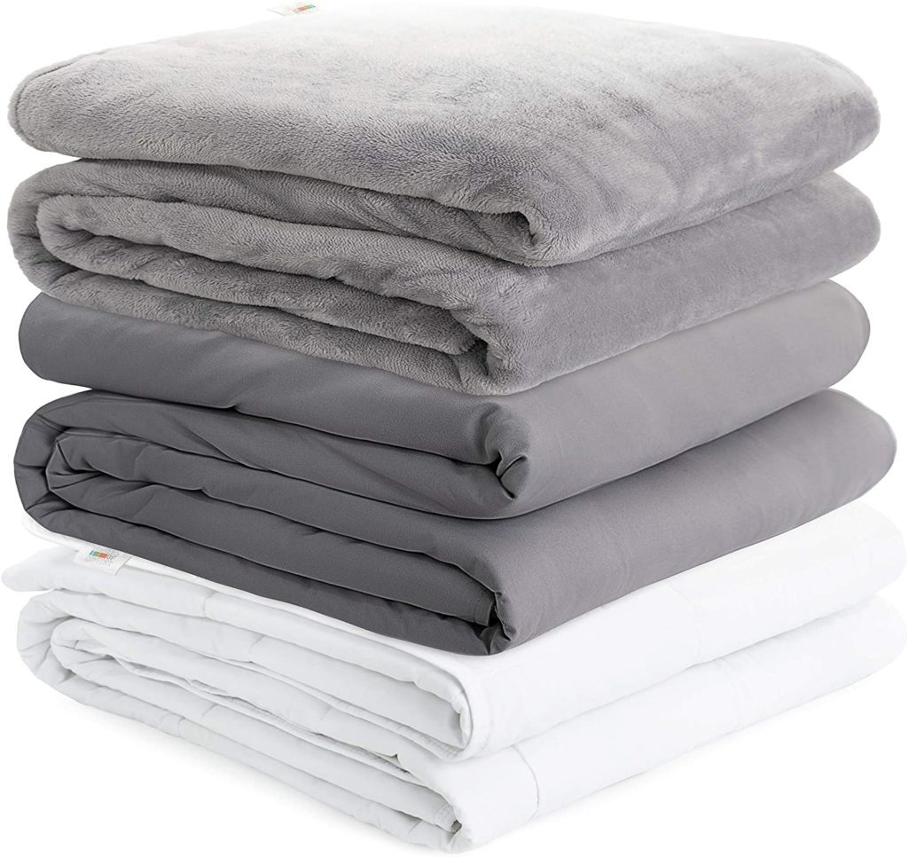 grey and white stacked blankets
