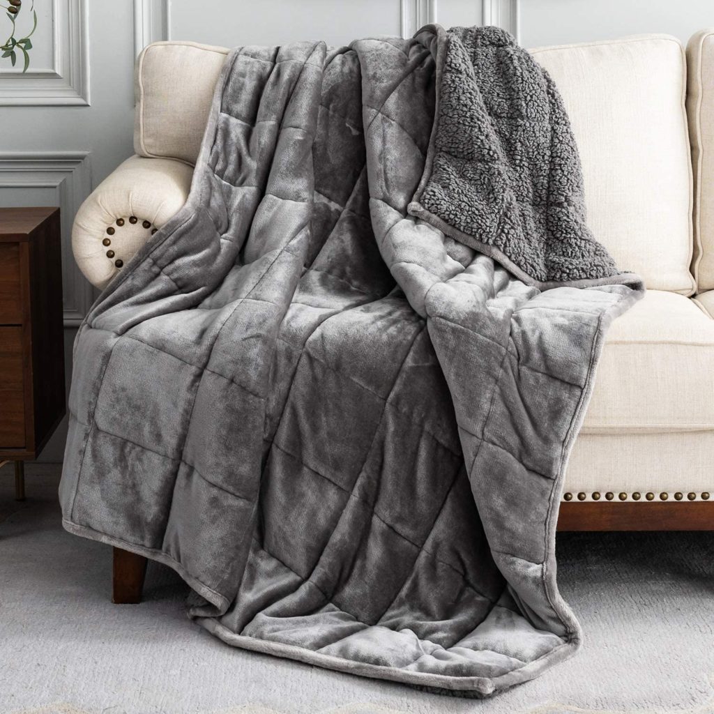 grey blanket draped over couch