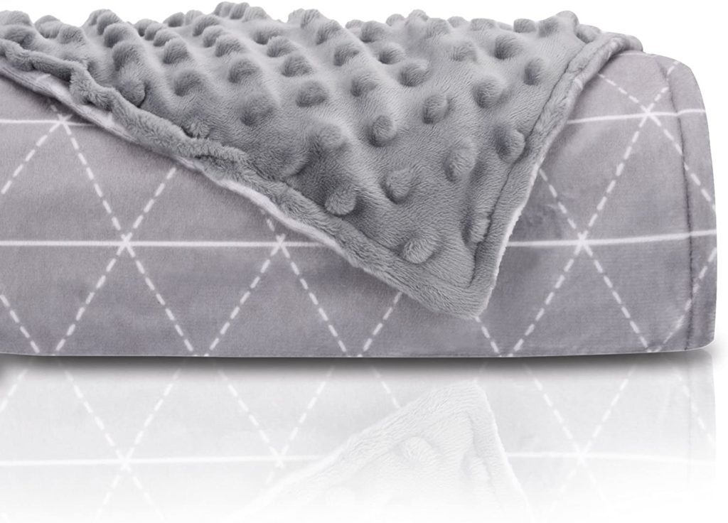 grey reversible weighted blanket wih geometric pattern