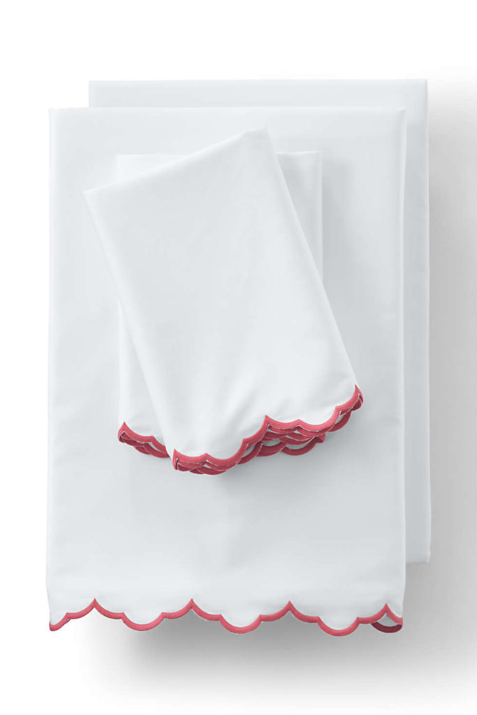 white cotton sheet set with red scalloped edges
