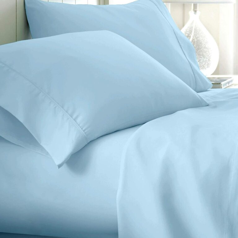light blue sheets and pillows on bed