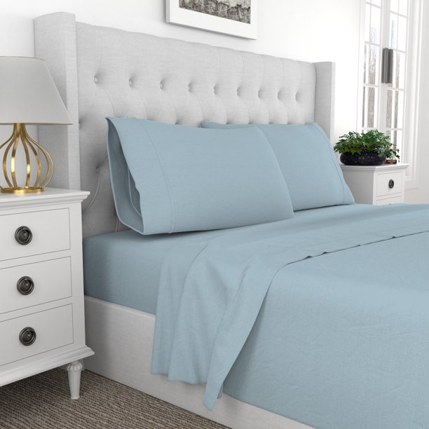 light blue sheets on bed in elegant room