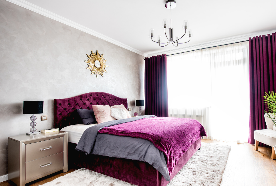 luxe bedroom with purple velvet bed