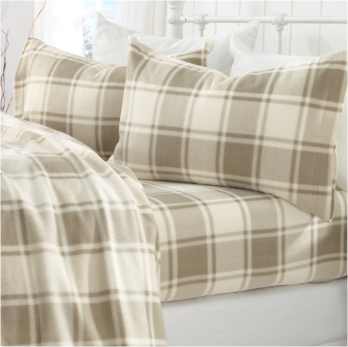 plaid cream and brown sheets on bed