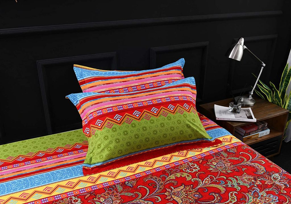 multicolored and multipatterned boho comforter and pillows
