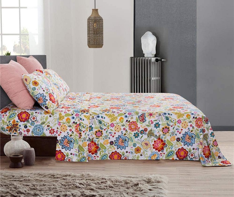multicolored floral sheets on bed