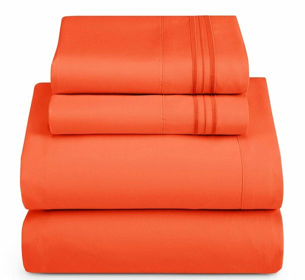 neatly folded and stacked orange sheet set