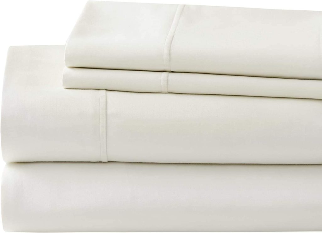 neatly folded cream stacked sheets