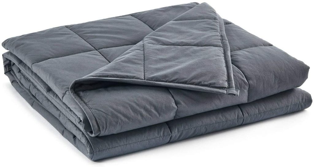 neatly folded dark grey blanket