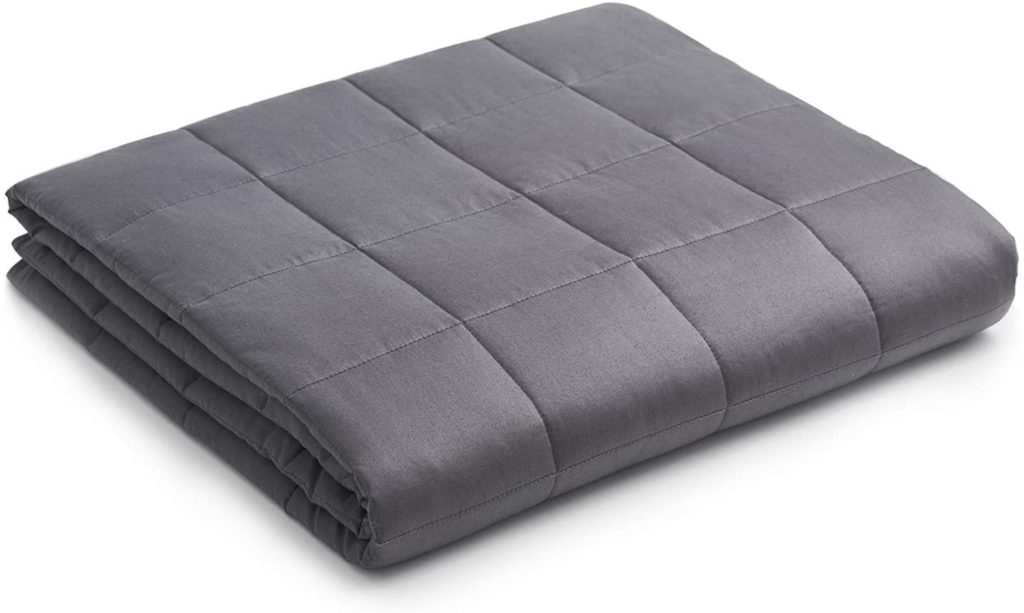 neatly folded grey blanket
