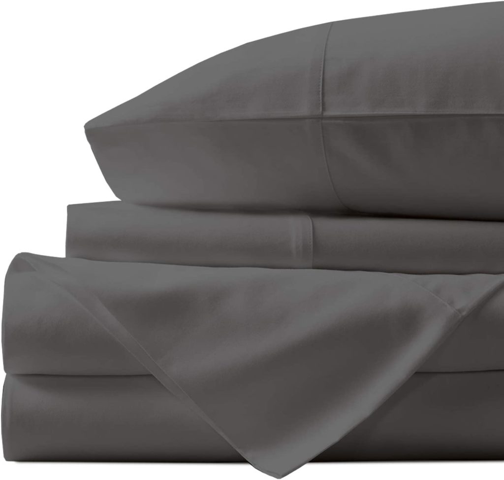 neatly folded grey stacked sheets