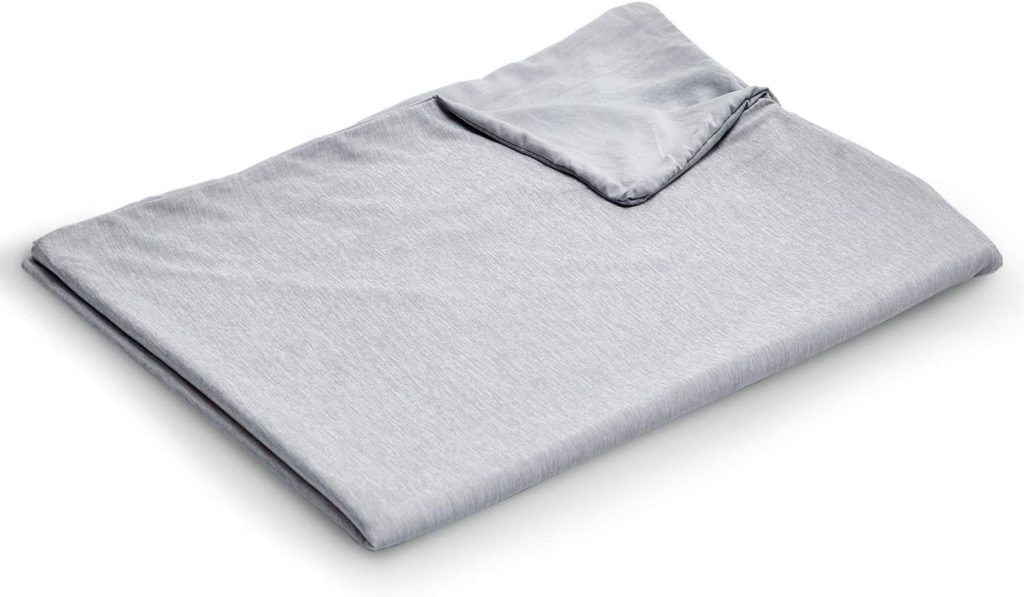 neatly folded light grey blanket cover