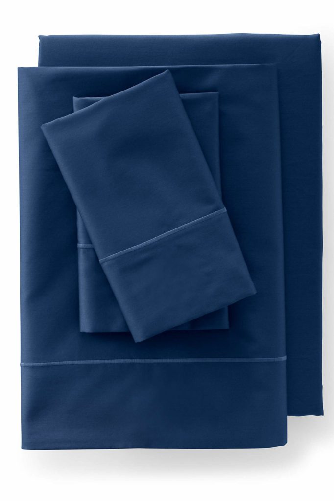 neatly folded navy blue sheets