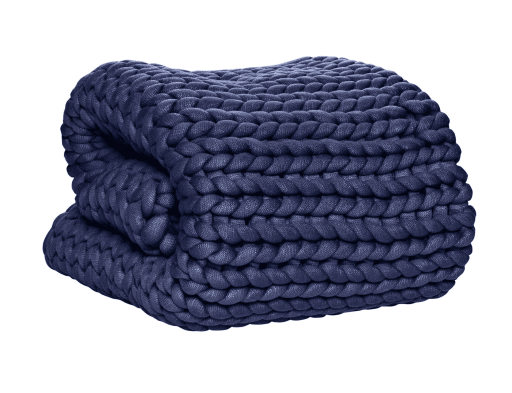 neatly folded oversized blue knit blanket