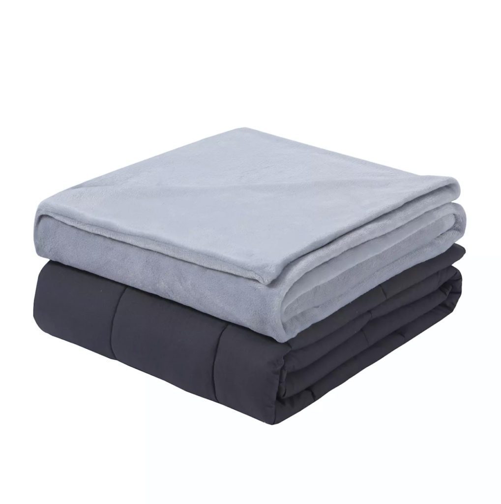 neatly folded set of grey blankets