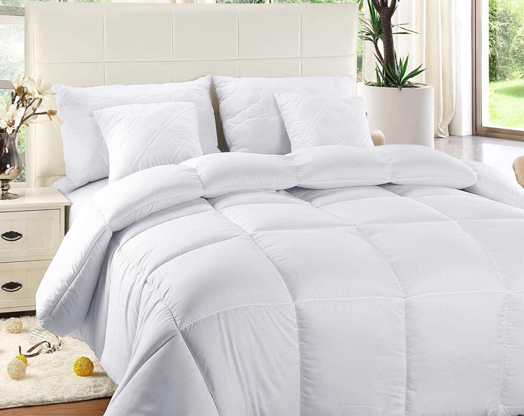 neatly made bed with white bedding
