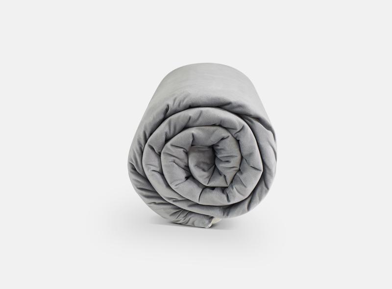 neatly rolled grey blanket