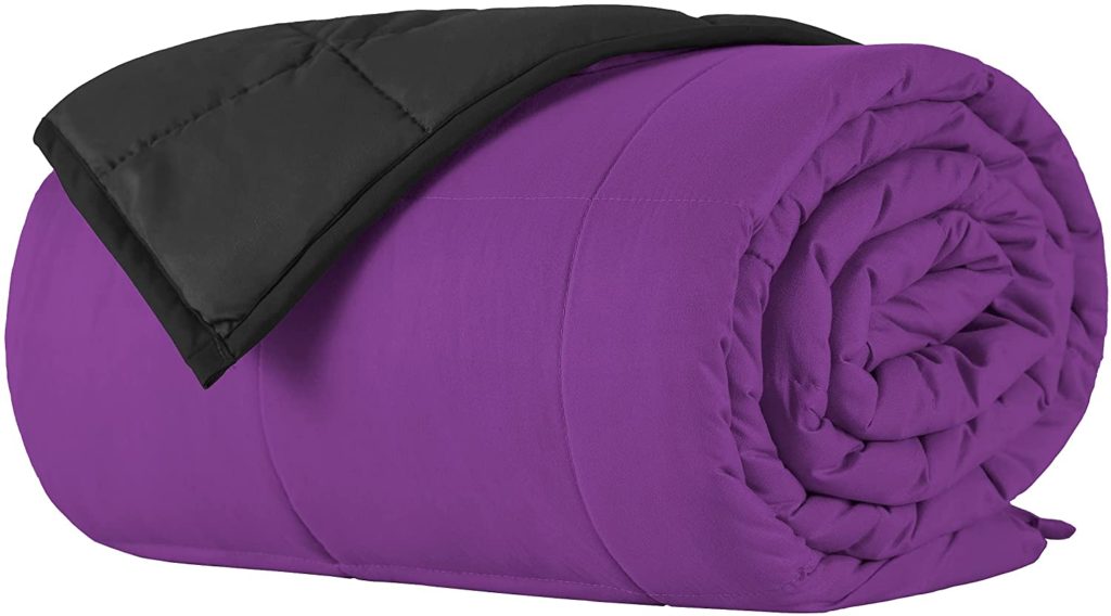 neatly rolled vibrant purple weighted blanket