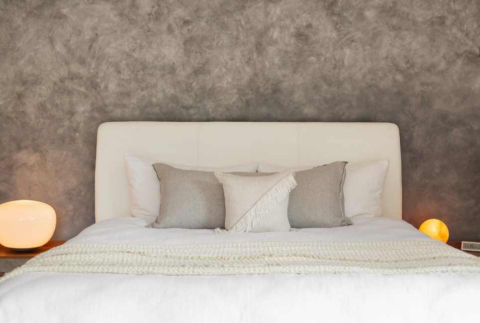 neutral bedding and cotton comforter on bed