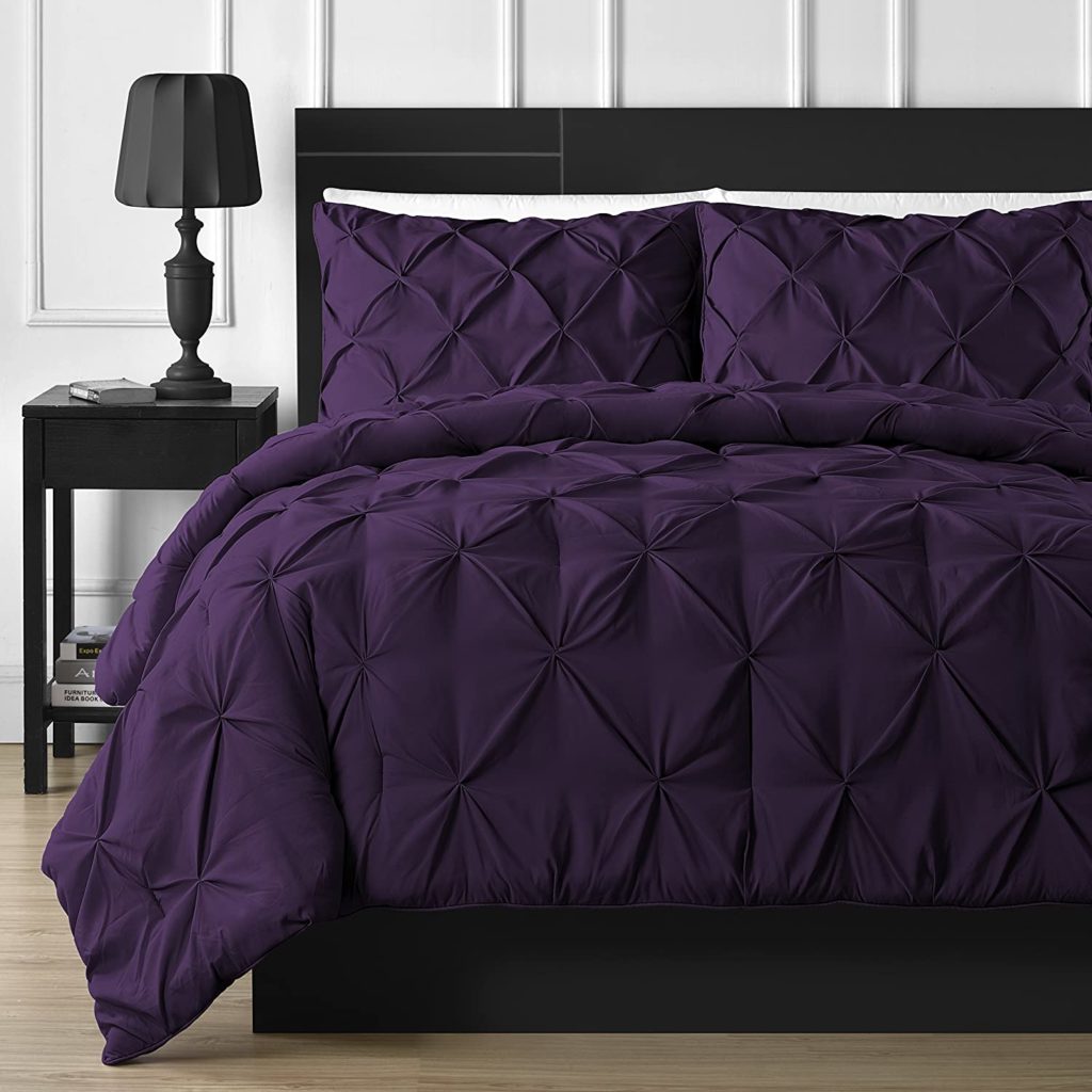 pinch pleat purple comforter on bed
