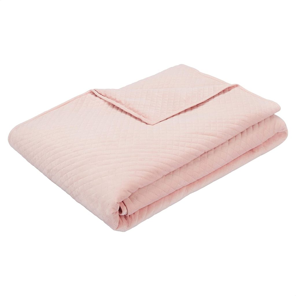pink texured blanket cover folded neatly