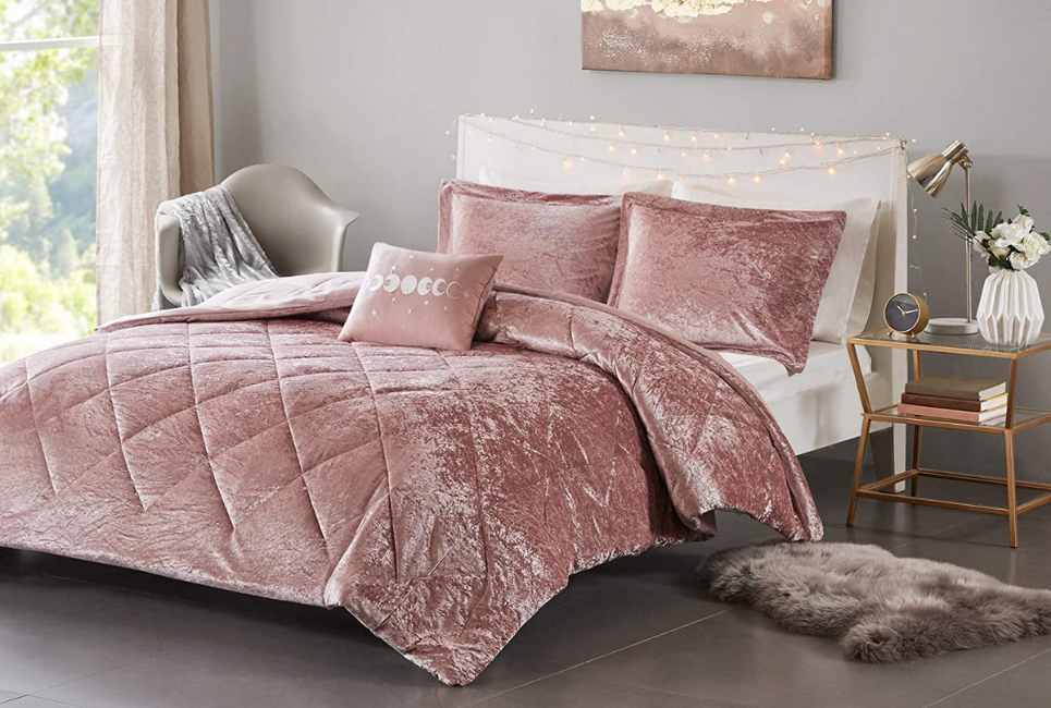 pink velvet comforter on bed