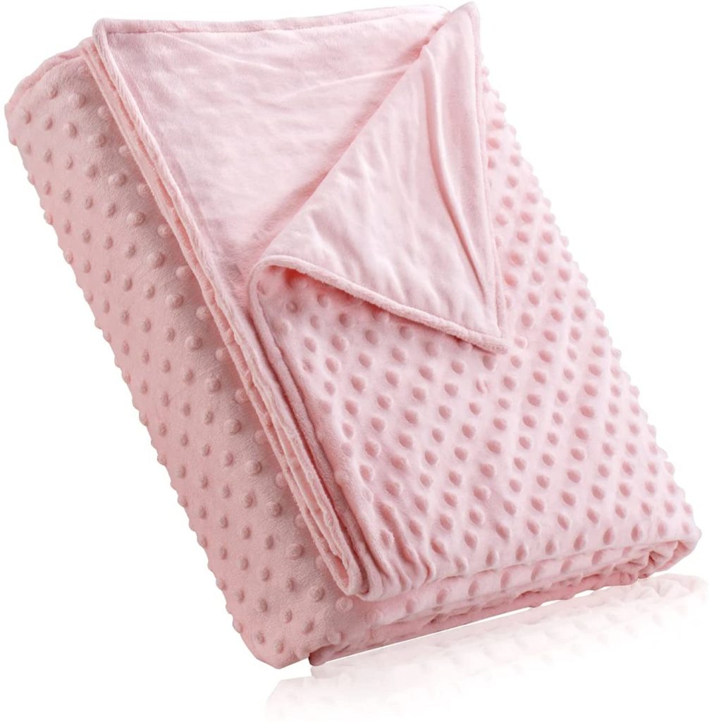 pink velvet texured blanket cover folded neatly