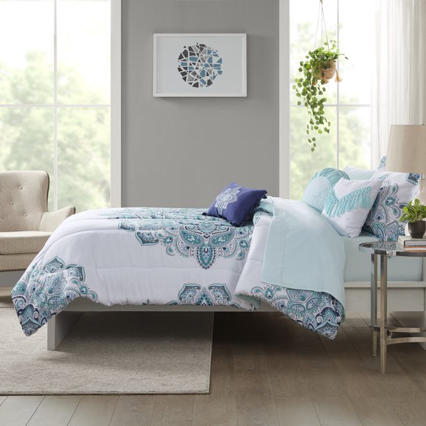 purple and teal medallion print white comforter on bed shown from side