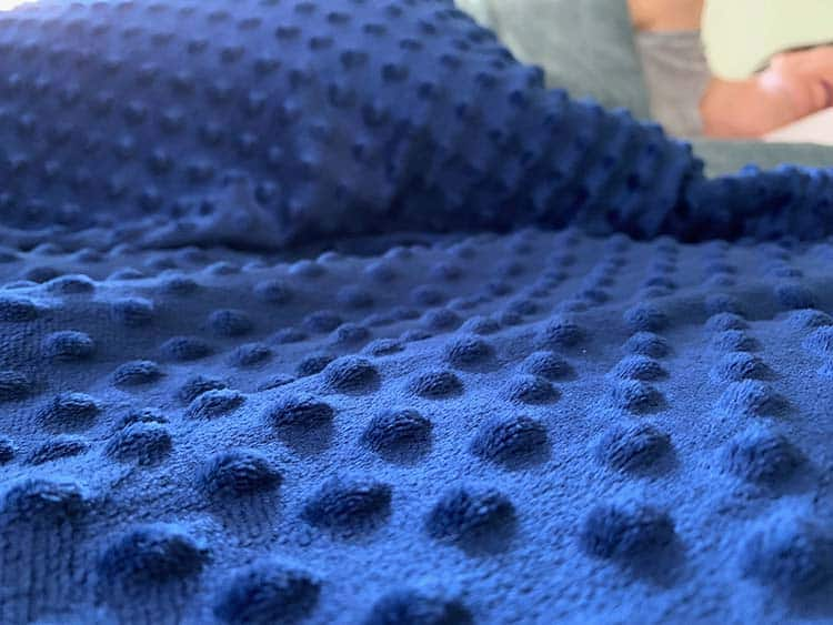 close up of blue quility weighted blanket texture