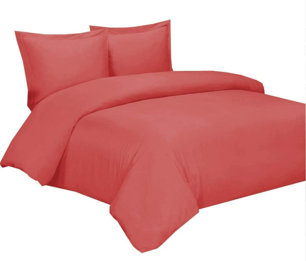 red orange comforter and pillows 1