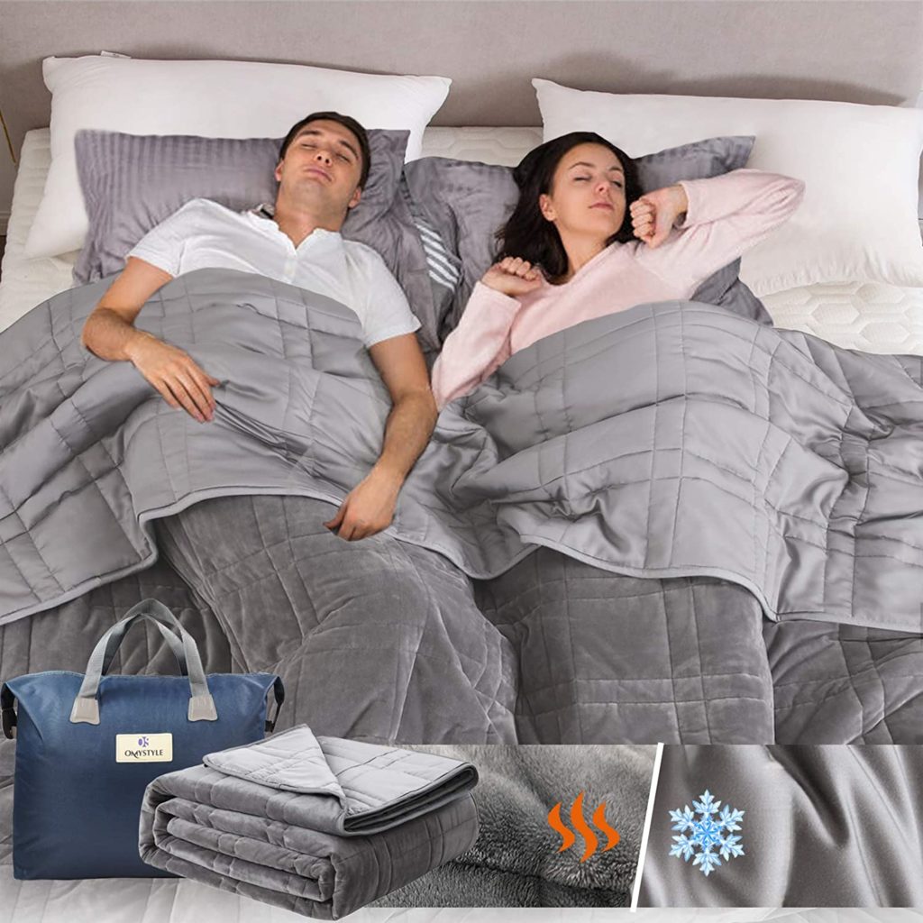 rendering of couple sleeping and strethcing in bed with grey bedding and packaging of bedding shown