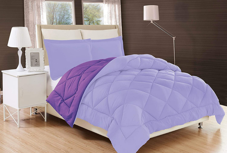 rendering of reversible light and dark purple comfoter on bed