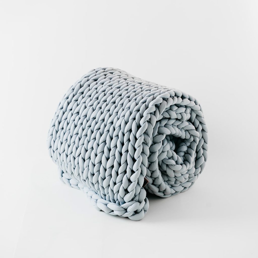 rolled up oversized knit blanket