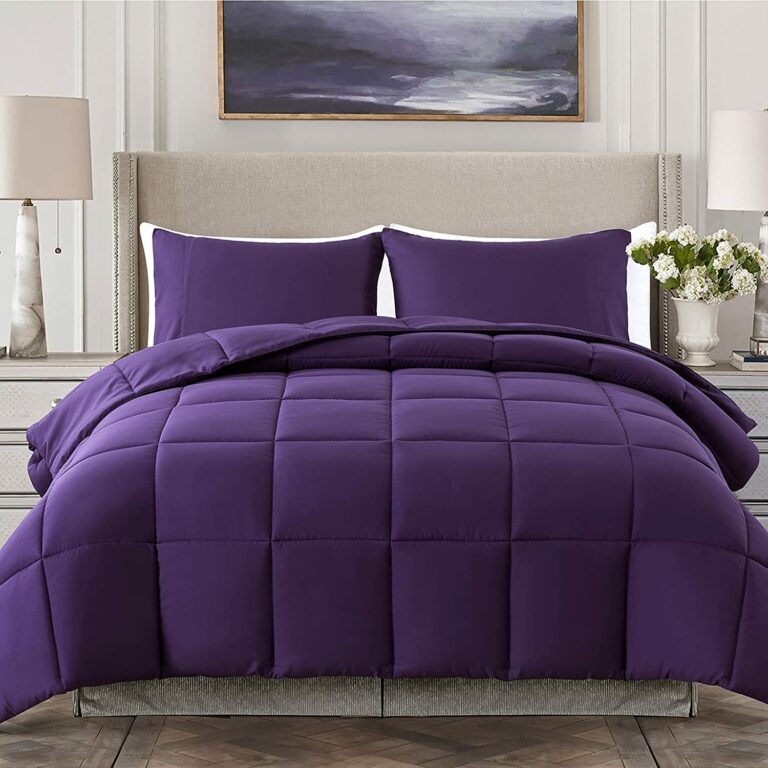 royal purple comforter on bed