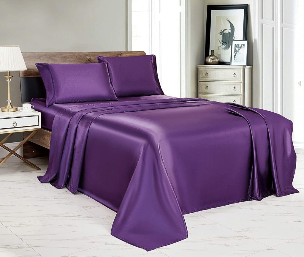 royal purple satin sheets on bed