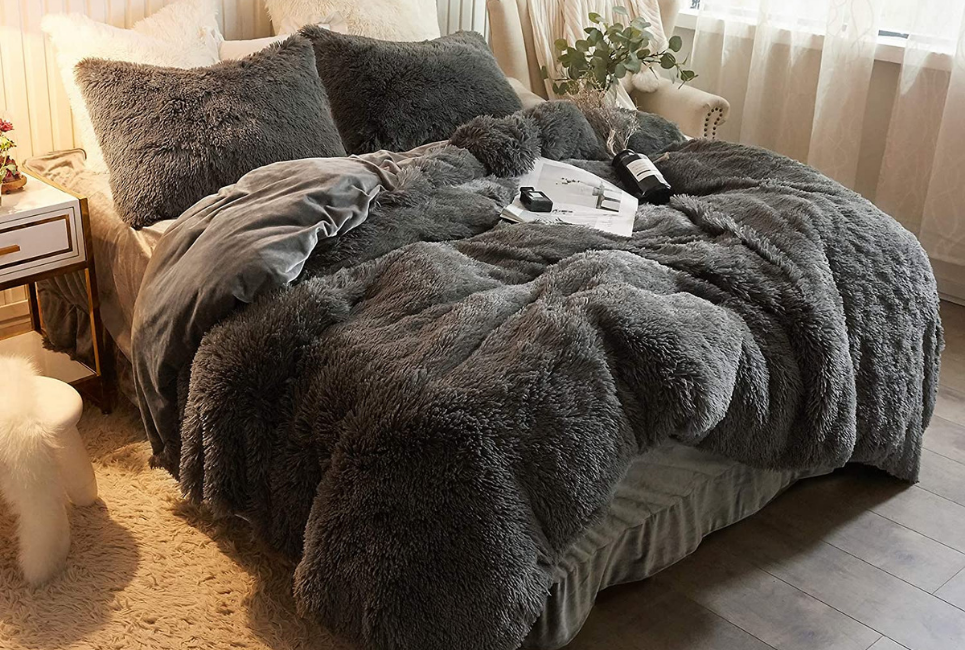 shaggy grey velvet comforter on bed