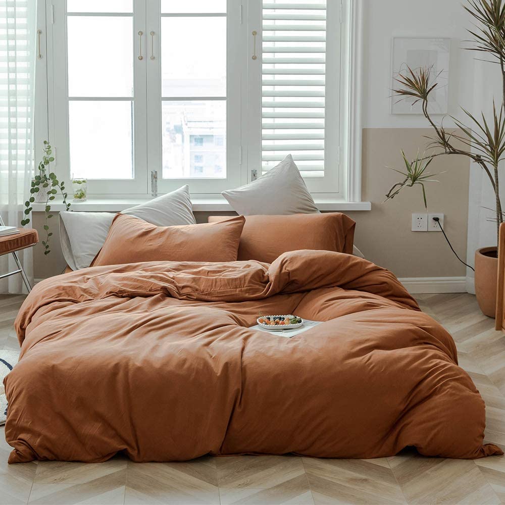 trendy brown comforter in cozy clean room
