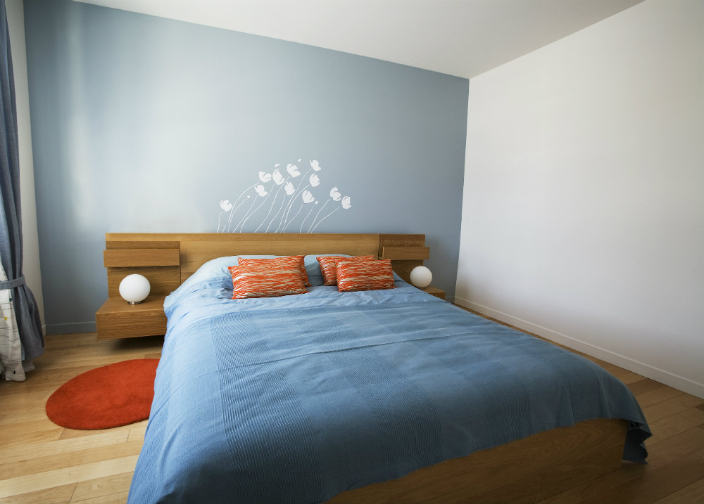 trendy modern room with blue bedding
