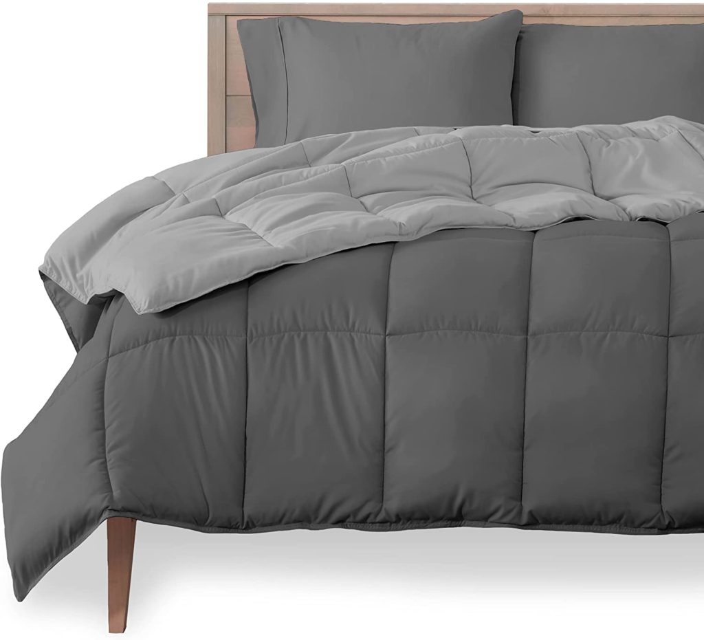 two toned grey reversible comforter on bed