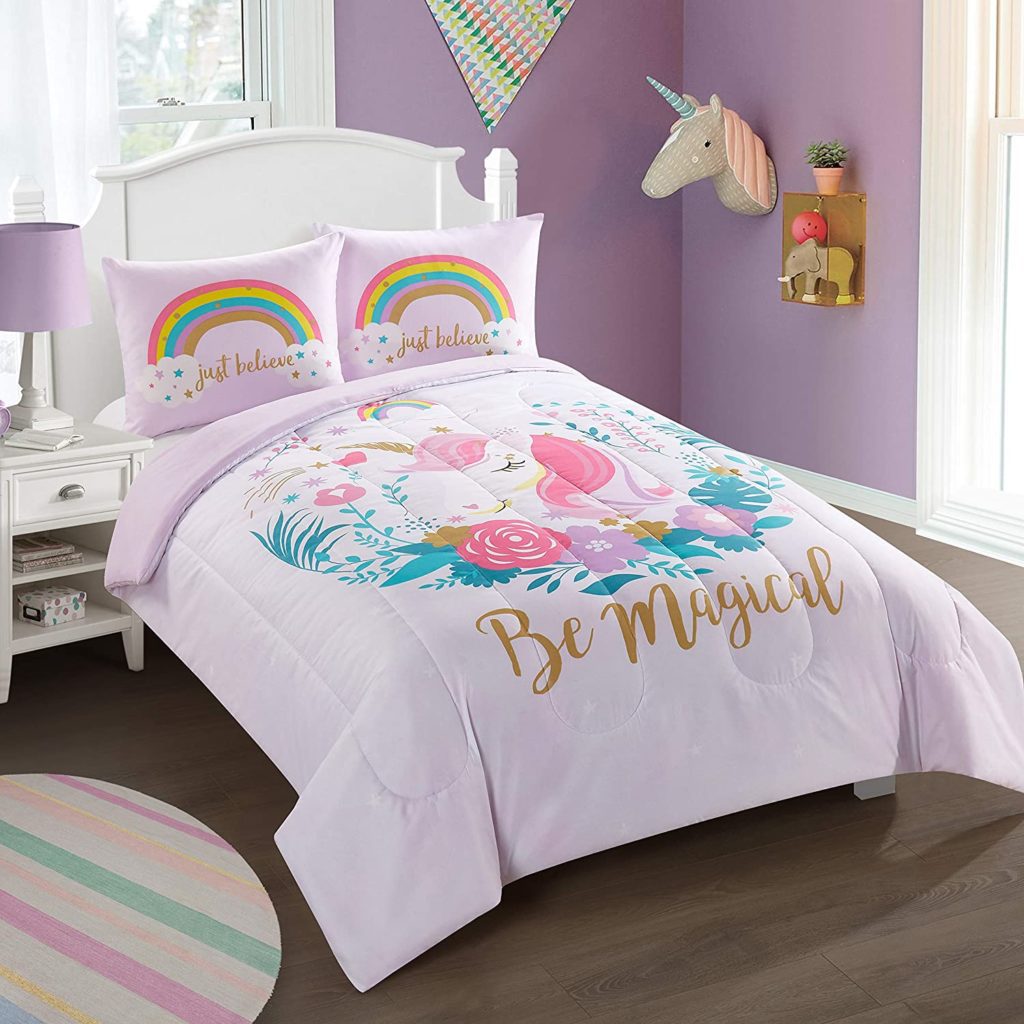 unicorn comforter with rainbows and flowers that reads be magical