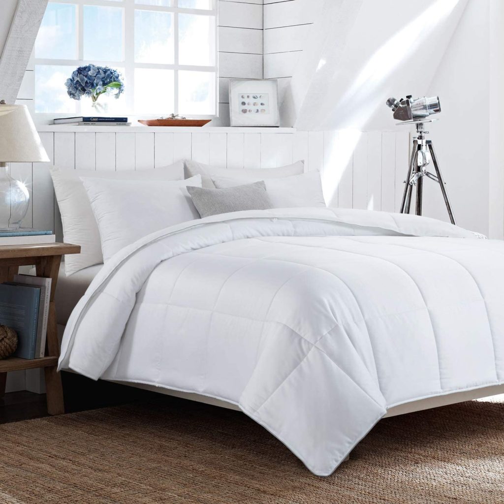 white bamboo comforter on bed in farmhouse room