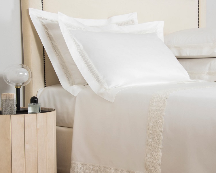 white pillowcase and sheets with ivory lace