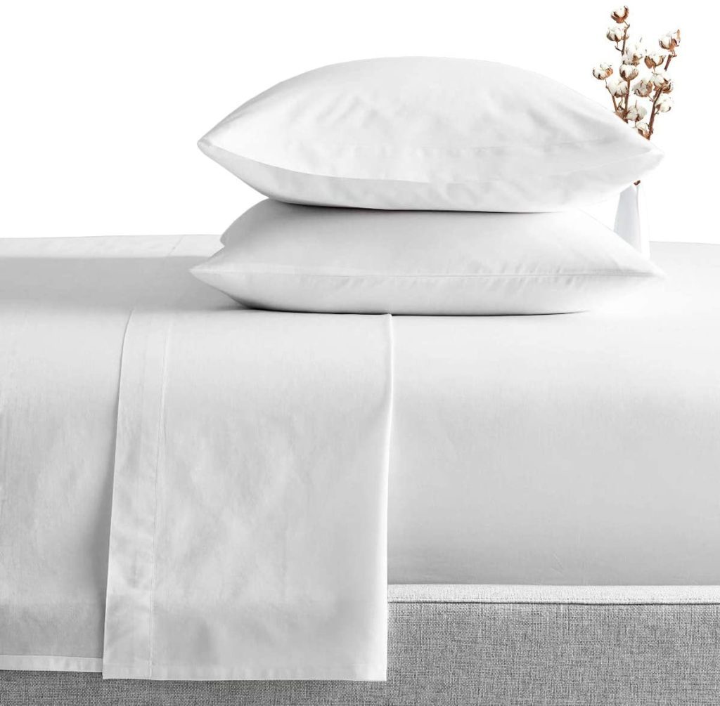 white pillows resting on white sheets