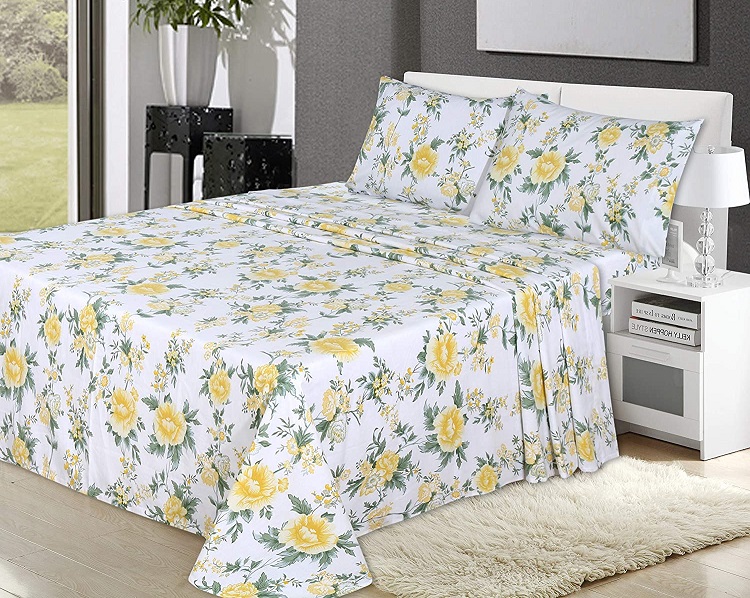 yellow floral sheets on bed