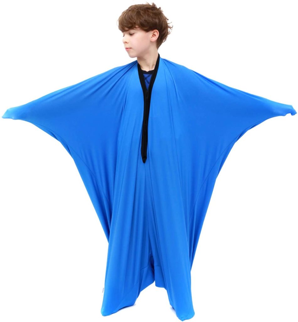 young boy in blue wearable compression blanket